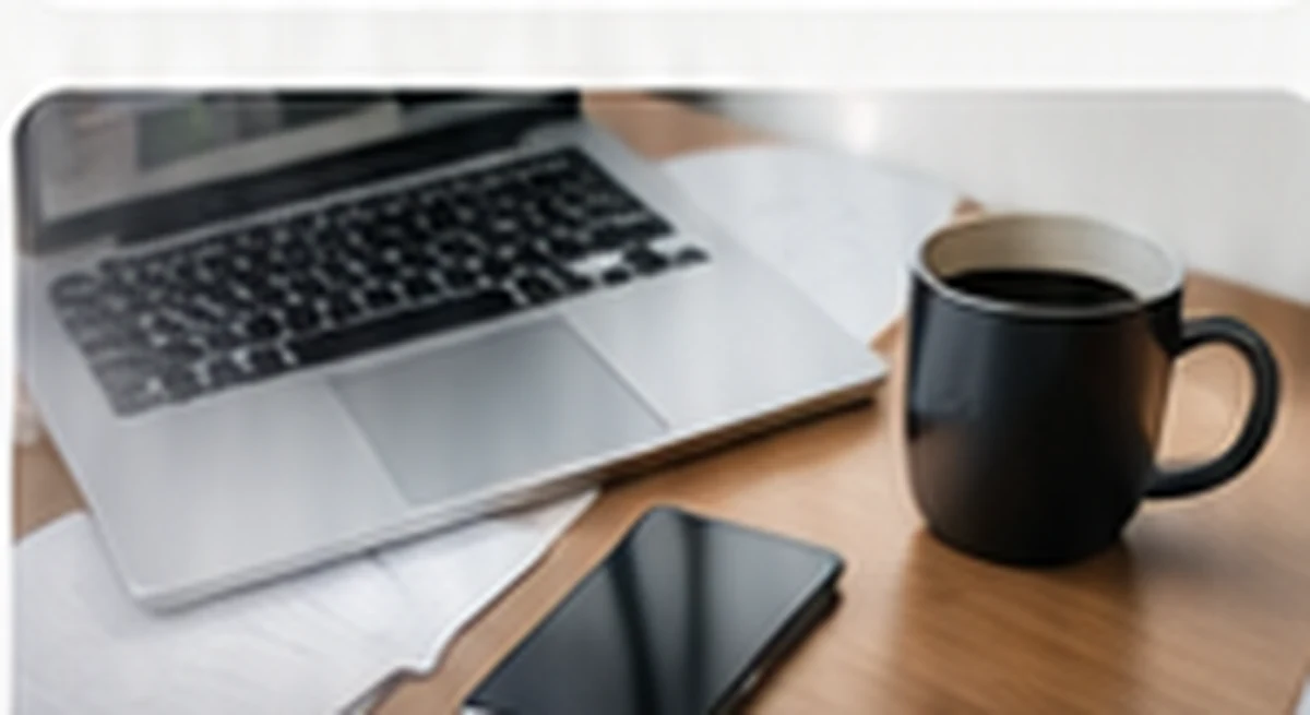 Modern bookkeeping workspace with laptop, phone and financial records